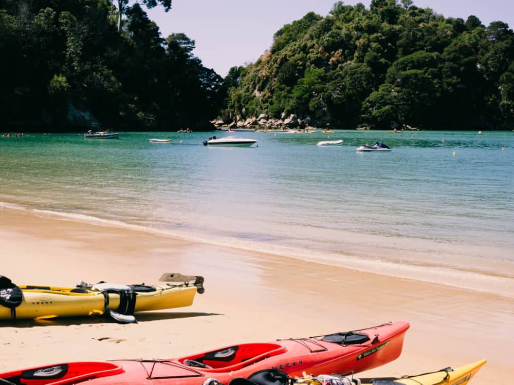 kayaks lying on kaiteriteri beach