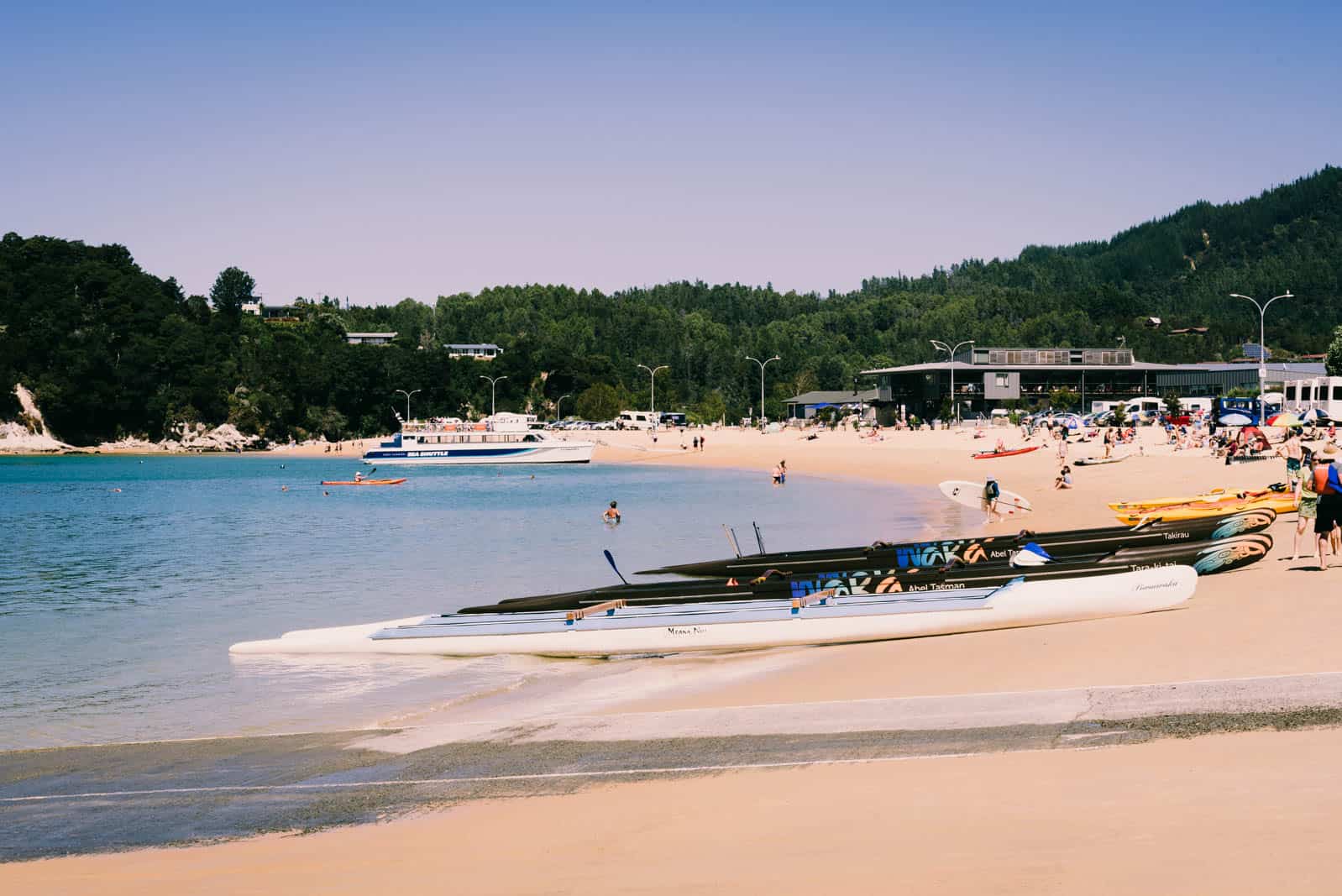 people at kaiteriteri beach