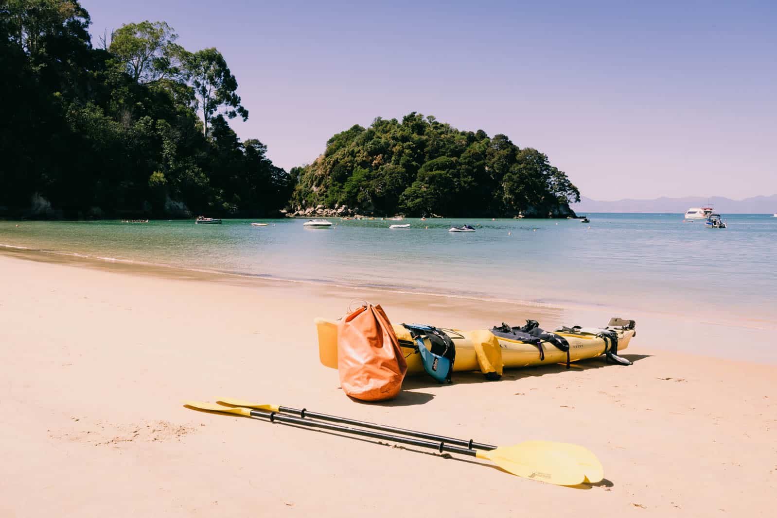 kayaks lying on kaiteriteri beach
