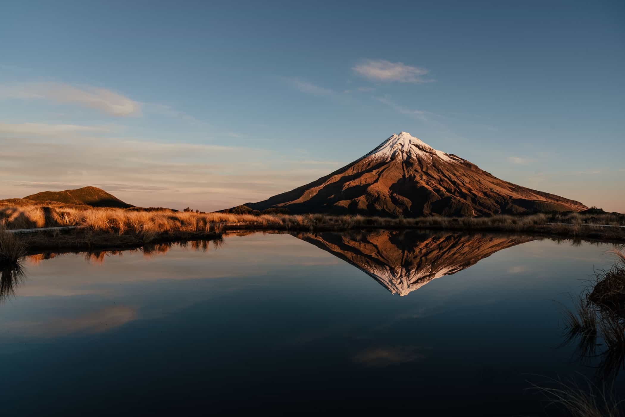 View of Mount Taranaki from Pouakai Tarns at sunset