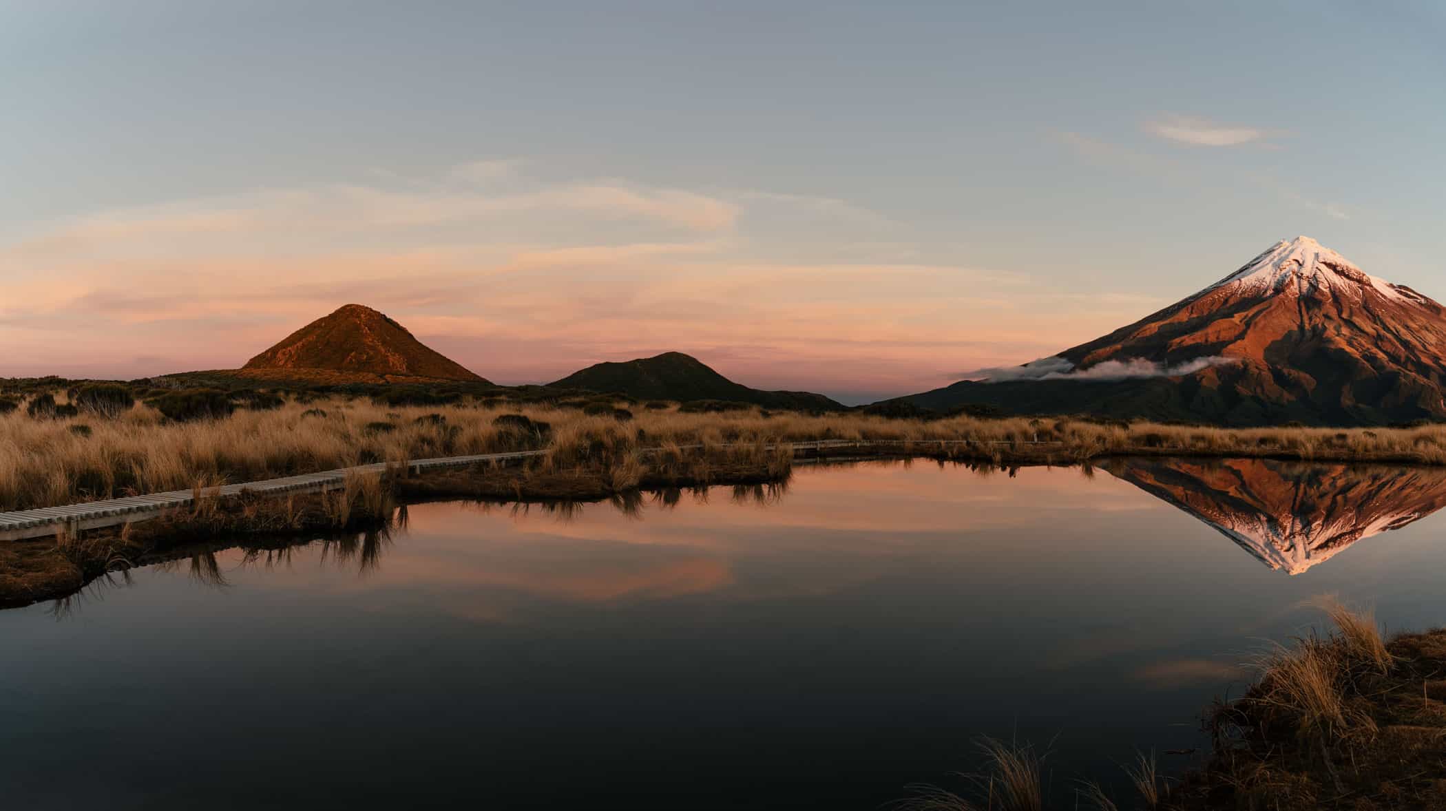 View of Mount Taranaki from Pouakai Tarns at sunset
